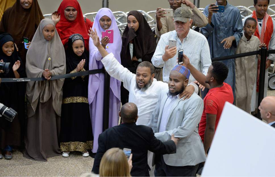 Scott Sommerdorf | The Salt Lake Tribune
Imam Yussuf Awadir Abdi is surrounded in a sea of friends, family, and media after he arrived at Salt Lake City International airport, Sunday, June 18, 2017.