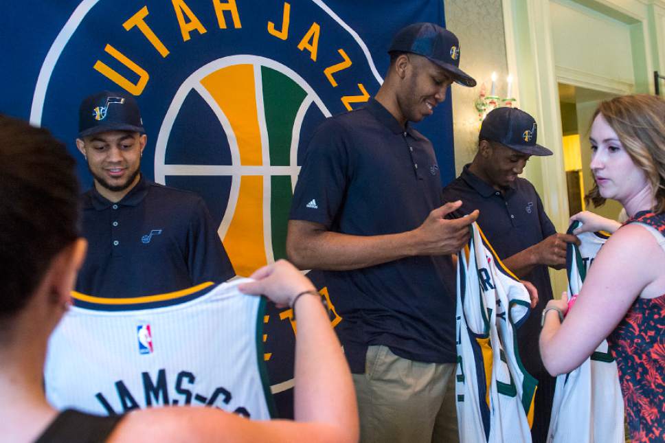 Chris Detrick  |  The Salt Lake Tribune
Utah Jazz's Nigel Williams-Goss, Tony Bradley and Donovan Mitchell look at their new jerseys at The Grand America Hotel Wednesday, June 28, 2017.