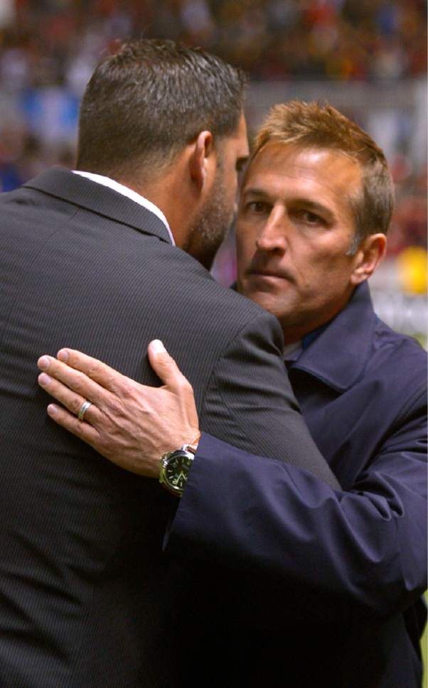 Former colleagues Real Salt Lake head coach Jeff Cassar and New York City FC head coach Jason Kreis share a hug after an MLS soccer game Saturday, May 23, 2015, in Sandy, Utah. (Leah Hogsten/The Salt Lake Tribune via AP) DESERET NEWS OUT; LOCAL TELEVISION OUT; MAGS OUT