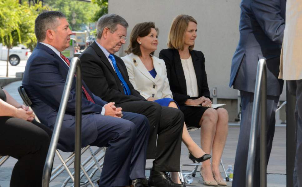 Steve Griffin  |  The Salt Lake Tribune


DWS Executive Director Jon Pierpont, Former Gov. Mike Leavitt and former First Lady Jackie Leavitt and Nena Slighting listen as Gov. Gary Herbert speaks during a renaming ceremony of the DWS building to honor former Gov. Olene Walker. Twenty years ago, Walker led an effort to make Utah the first state to consolidate employment and public assistance programs. The event was held outside the DWS building in Salt Lake City Thursday June 29, 2017.