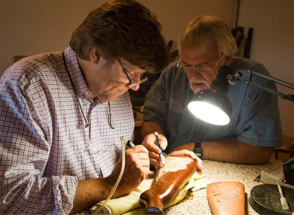 Rick Egan  |  The Salt Lake Tribune

Jerry Hale carves a gun stock as sculptor Steve Bartholomew assists, in Bartholomew's cabinet store in Cedar City. June 14, 2017.
