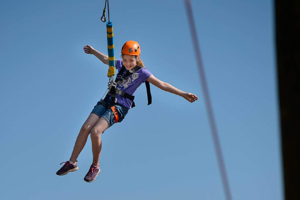 Trent Nelson  |  The Salt Lake Tribune
Janae Kinzer swings at the National Ability Center in Park City, Tuesday June 20, 2017. With help from the Utah Office of Outdoor Recreation, Governor's Office of Economic Development and Intermountain Healthcare, the National Ability Center has expanded its ropes course.