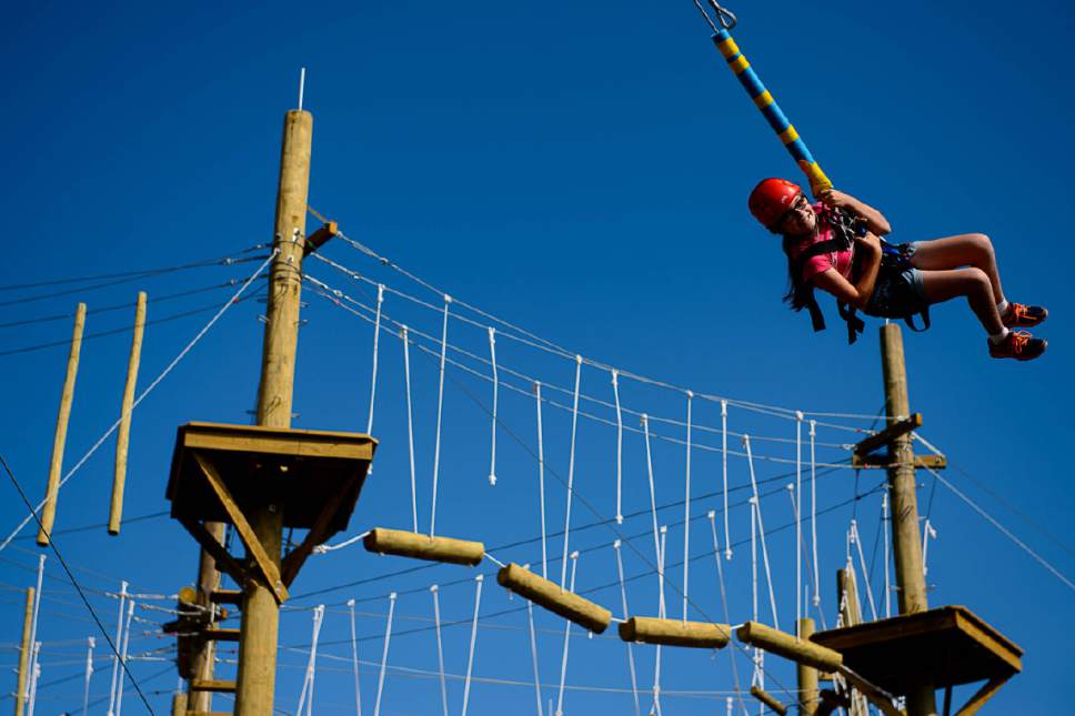 Trent Nelson  |  The Salt Lake Tribune
A young girl swings at the National Ability Center in Park City, Tuesday June 20, 2017. With help from the Utah Office of Outdoor Recreation, Governorís Office of Economic Development and Intermountain Healthcare, the National Ability Center has expanded its ropes course.