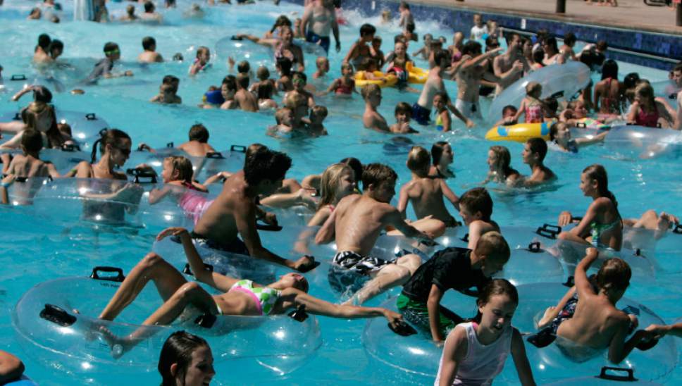 |  Tribune File Photo

The wave pool is packed by swimmers looking to escape the heat Tuesday, July 7, 2009 at Seven Peaks water park in Provo.
