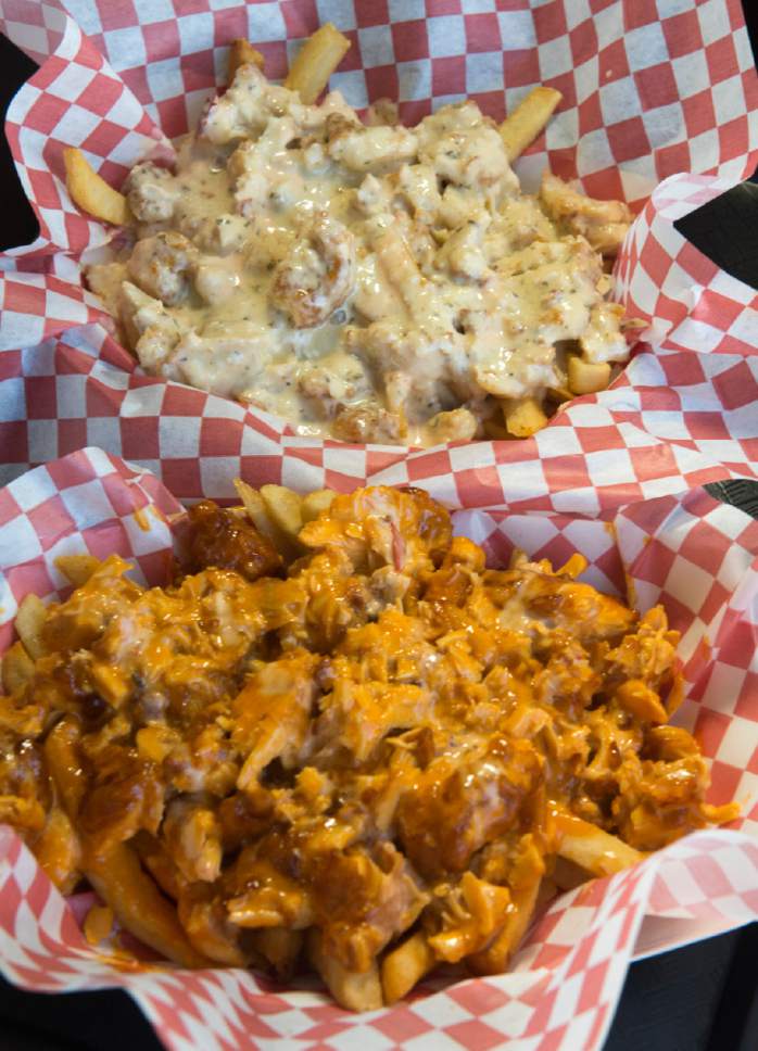 Rick Egan  |  The Salt Lake Tribune

Chicken fries with medium sauce and  galactic chicken fries with garlic sauce, at Stellar Wings in South Salt Lake.