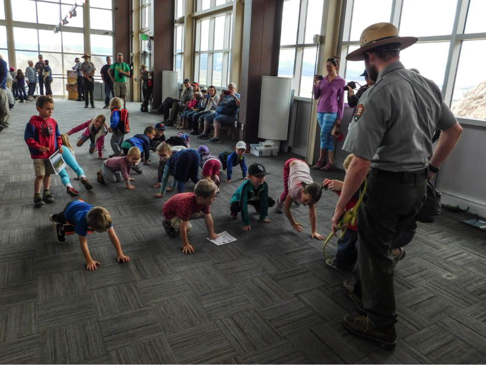 Erin Alberty  |  The Salt Lake Tribune


Ranger John Isom leads kids in a dinosaur walking game to explain the difference between bird-hipped and lizard-hipped dinosaurs Saturday, May 27, 2017, at Dinosaur National Monument's Quarry Exhibit Hall.