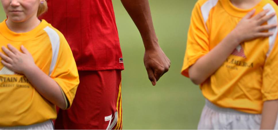 Leah Hogsten  |  The Salt Lake Tribune
"I don't personally feel that acknowledging issues within the country and being a proud American are mutually exclusive," said Real Salt Lake defender Jordan Allen, who places his right hand over his heart and fists his left hand, holding it out to the side during the National Anthem during the season home opener, March 4, 2017. Allen said his stance is "not as much of a protest as it is an acknowledgement of the civil issues within our country"