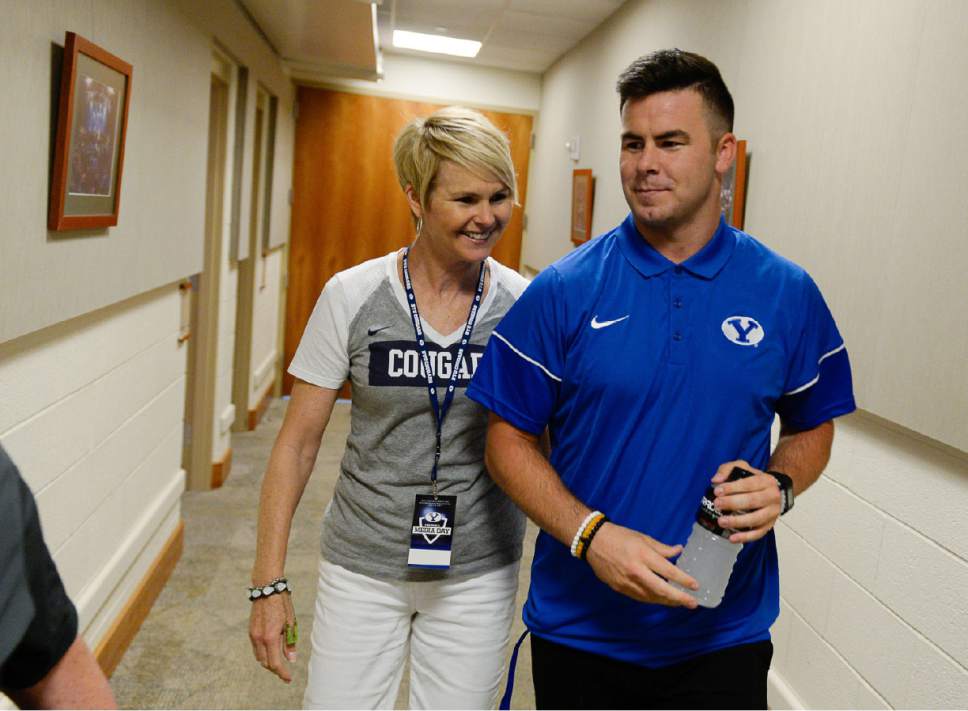 Francisco Kjolseth | The Salt Lake Tribune
BYU quarterback Tanner Mangum is joined by his mother Karen as he gets ready for Football Media Day at the BYU Broadcast Building on Friday, June 23, 2017.  Mangum posted on Instagram in the Spring that he has dealt with depression and has taken medication for it.