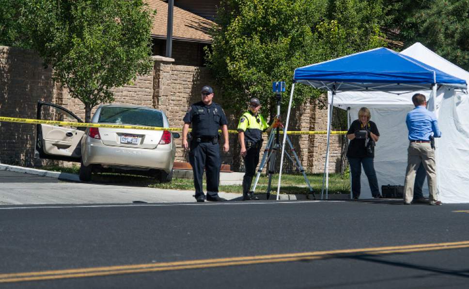 Leah Hogsten  |  The Salt Lake Tribune
West Jordan Police investigate the scene where a woman is dead after a drive-by shooting incident in West Jordan on Wednesday morning. West Jordan police Sgt. Joe Monson said the woman, whose identity was not immediately released, was stopped at a stop light at Jaguar Drive (2700 West) and 7800 South, when at least one shot was fired into her car at 8:59 a.m.. Her car crashed into a wall and a tree a short distance later.

Monson confirmed the woman was found dead at the scene.