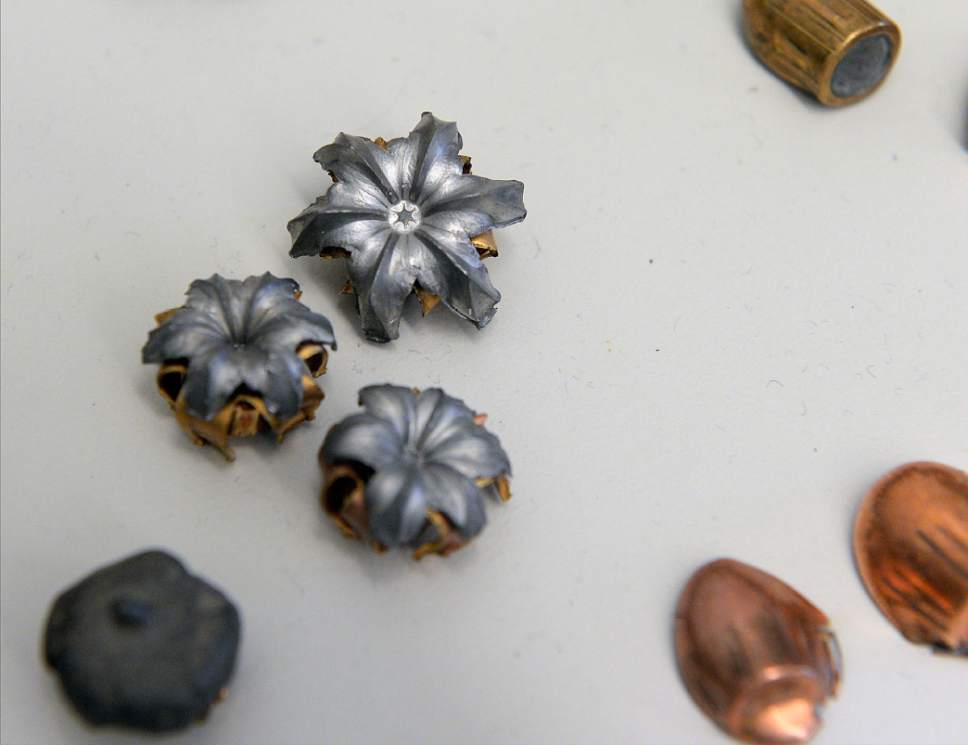 Al Hartmann  |  The Salt Lake Tribune
The flowerlike shape a bullet makes after impact on display at the new state crime lab in Taylorsville on Thursday, June 29, 2017. Some law enforcement agencies in the state work with the crime lab on processing evidence from DNA to fingerprints and firearm forensics.