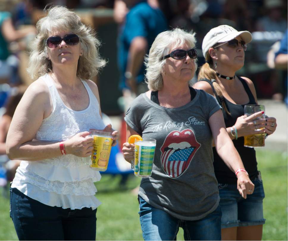 Rick Egan  |  The Salt Lake Tribune

Susan Evanatte, Vicky Knight and Heidi Smith, dance to the music of Too Slim and theTaildraggers, at Snowbasin Resort during the Blues Brews and BBQ on the lawn at Earl's Lodge, Sunday, July 2, 2017.