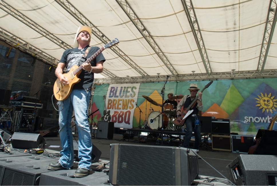 Rick Egan  |  The Salt Lake Tribune

Tim "Too Slim" Langford plays guitar for  Too Slim and theTaildraggers, at Snowbasin Resort during the Blues Brews and BBQ on the lawn at Earl's Lodge, Sunday, July 2, 2017.