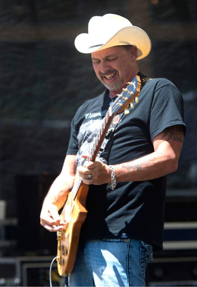 Rick Egan  |  The Salt Lake Tribune

Tim "Too Slim" Langford plays guitar for  Too Slim and theTaildraggers, at Snowbasin Resort during the Blues Brews and BBQ on the lawn at Earl's Lodge, Sunday, July 2, 2017.