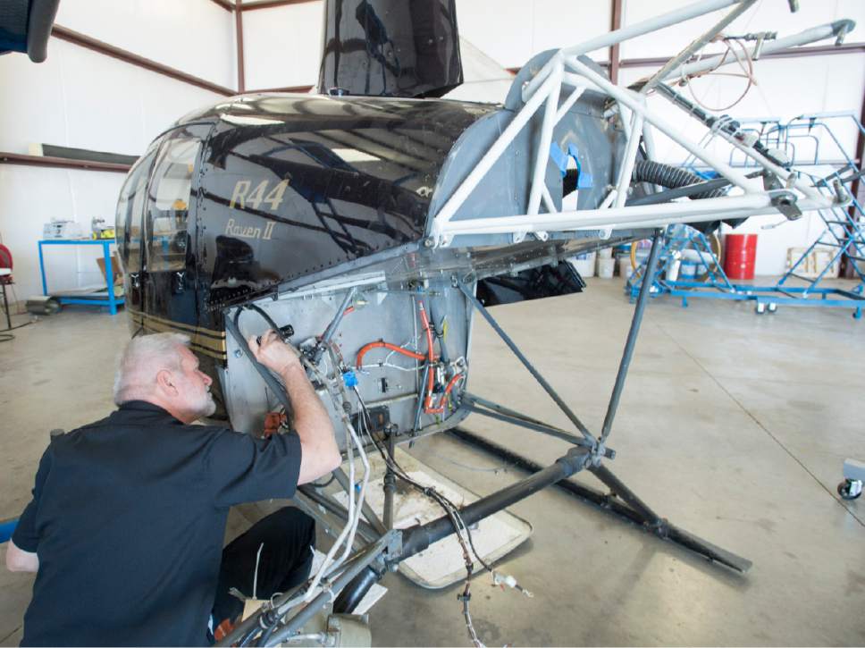 Rick Egan  |  The Salt Lake Tribune

Willy Robinet inspects an R44 Raven II helicopter, used in the Southern Utah University Flight School. Wednesday, June 14, 2017.