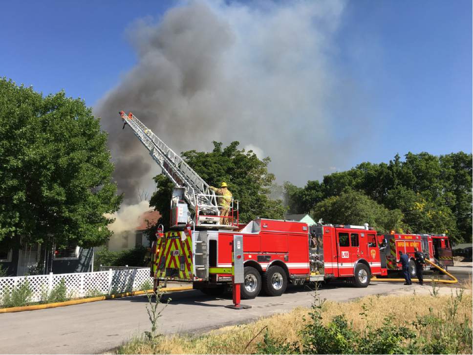 Alex Gallivan  |  Special to the Tribune
Fire crews respond to a fire burning near 3329 S. 735 E. in Millcreek on Monday.