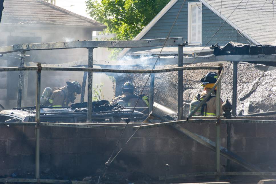 Alex Gallivan  |  Special to the Tribune      


Fire crews respond to a fire burning near 3329 S. 735 E. in Millcreek on Monday, July 3, 2017.