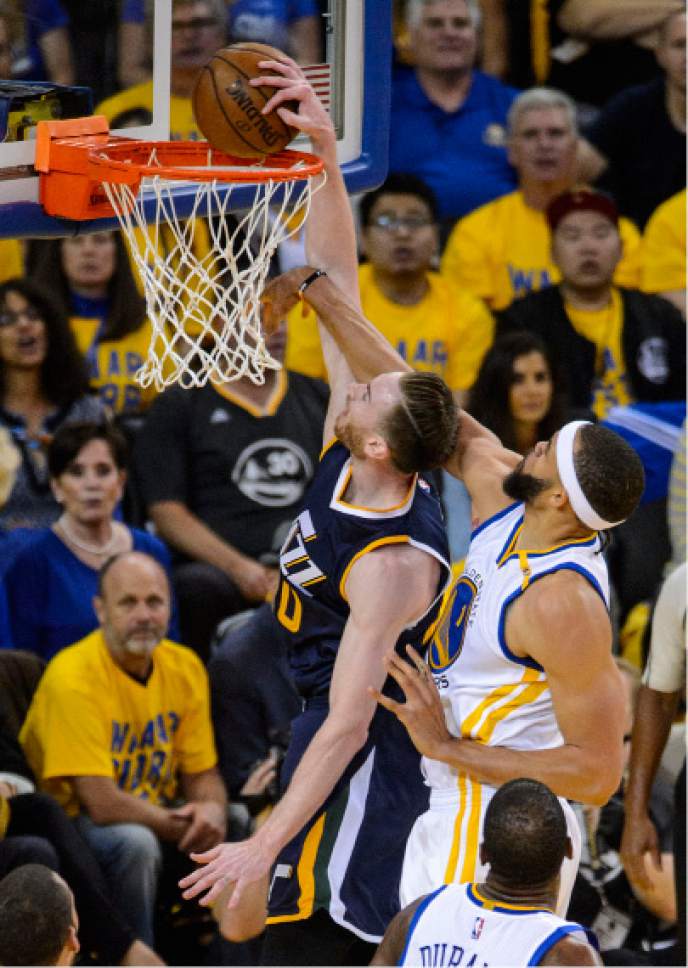 Steve Griffin  |  The Salt Lake Tribune


Utah Jazz forward Gordon Hayward (20) gets fouled by Golden State Warriors center JaVale McGee (1) as he tries to slam the ball during game 2 of the NBA playoff game between the Utah Jazz and the Golden State Warriors at Oracle Arena in Oakland Thursday May 4, 2017.