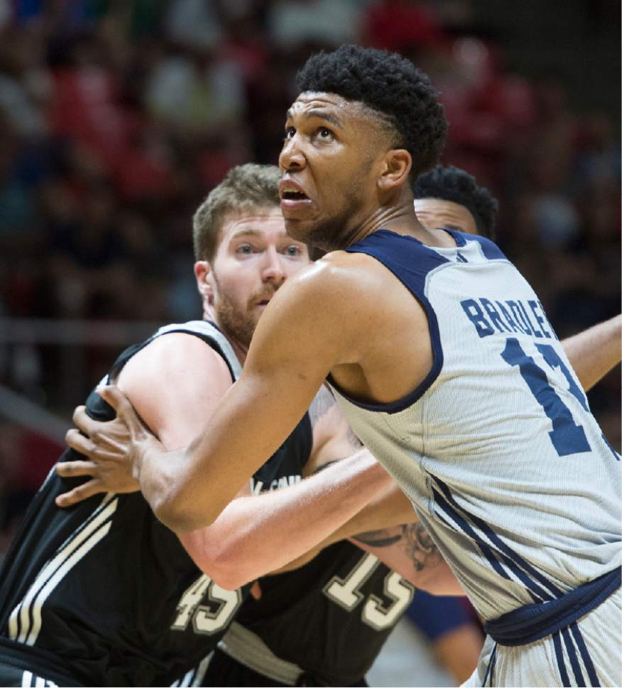Rick Egan  |  The Tribune file photo
Utah's Tony Bradley (13), boxing out for a rebound against San Antonio in a Utah Summer League game Monday, and fellow first-rounder Donovan Mitchell signed their rookie contracts Wednesday.