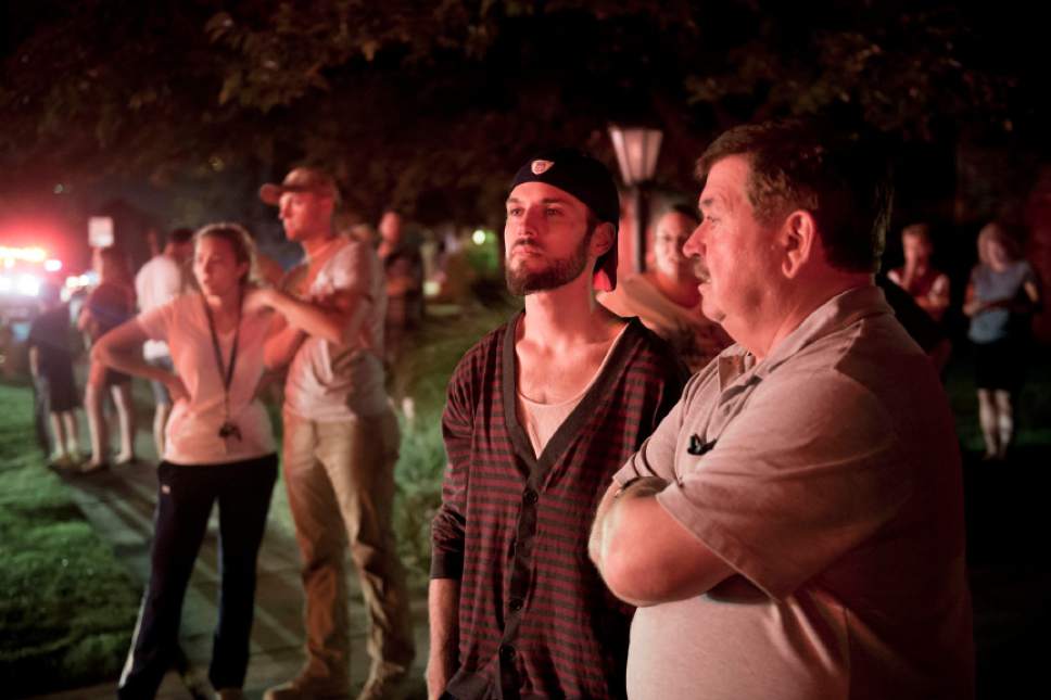 Jeremy Harmon  |  The Salt Lake Tribune


Dave Schoenbeck, center, talks to his neighbor Ron Bagley, right, as they stand across the street from Schoenbeck's fire damaged home fire in Cottonwood Heights on Tuesday, July 4, 2017. Bagley had to evacuate his house as flames approached the neighborhood earlier.