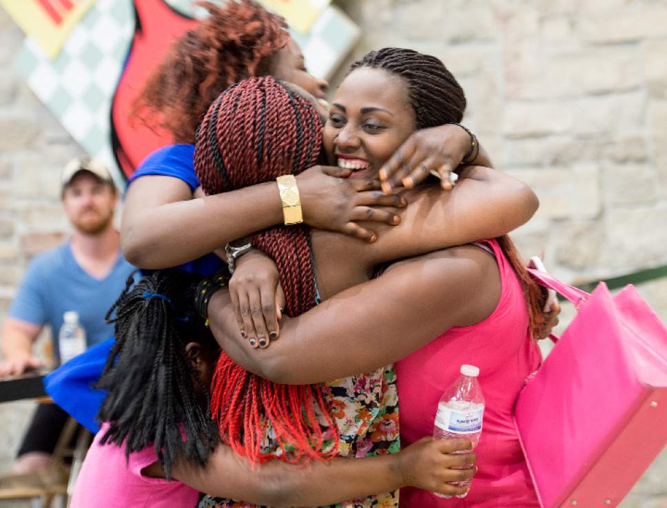 Leah Hogsten  |  The Salt Lake Tribune


Adeline Uwicyeza is greeted by fellow family and friends moments after her arrival to Salt Lake City with her mother and four other siblings from the Democratic Republic of Congo. The Salt Lake City office of the International Rescue Committee welcomed the last refugee family to Utah on Thursday,  July 6, 2017, before President Donald Trump's 120-day ban on refugees goes into effect.