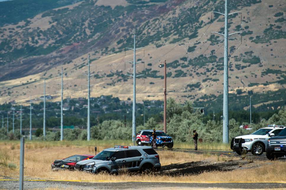 Chris Detrick  |  The Salt Lake Tribune
The scene of an officer-involved shooting on Legacy Parkway near Glover Lane in Centerville Tuesday, July 4, 2017.