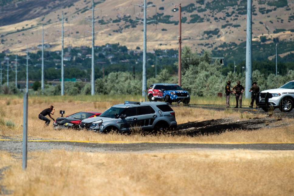 Chris Detrick  |  The Salt Lake Tribune
The scene of an officer-involved shooting on Legacy Parkway near Glover Lane in Centerville Tuesday, July 4, 2017.
