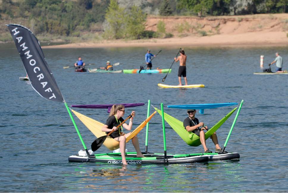 Al Hartmann  |  The Salt Lake Tribune 
Folks try out a Hamocraft paddle board at the the annual Outdoor Retailer Summer trade show at Pineview Reservoir Tues. Aug. 2.