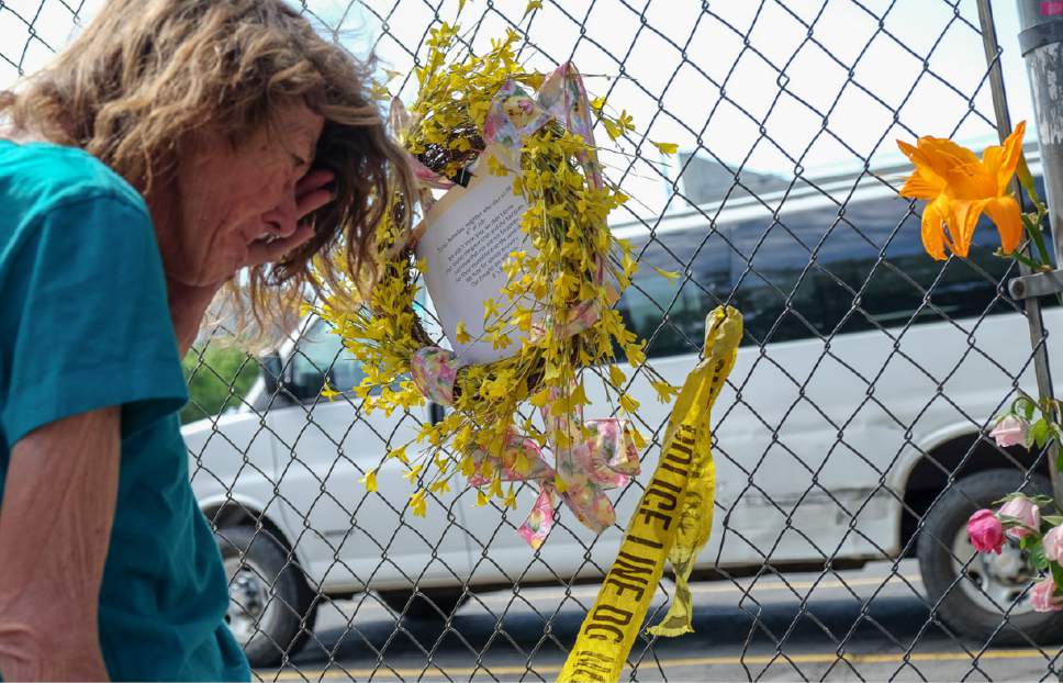 Francisco Kjolseth | The Salt Lake Tribune
A homeless woman who said she lost a close friend, reacts at the scene of a makeshift memorial placed where where a woman plowed her vehicle into six people Tuesday afternoon on 200 South near 400 West  in Salt Lake, just outside The Road Home shelter. One woman in a wheelchair was declared dead at the scene.