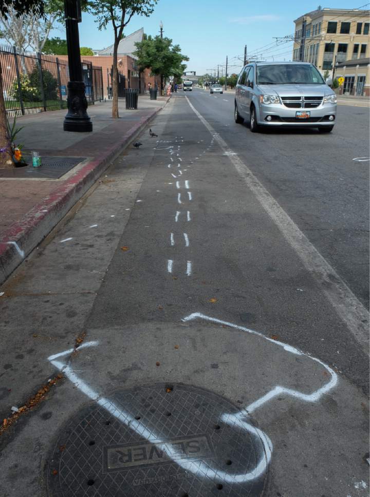 Francisco Kjolseth | The Salt Lake Tribune
Spray paint marks mark the outline of a wheelchair belonging to a homeless woman who was killed when a woman plowed her vehicle into six people Tuesday afternoon on 200 South near 400 West in Salt Lake, just outside the Road Home shelter.