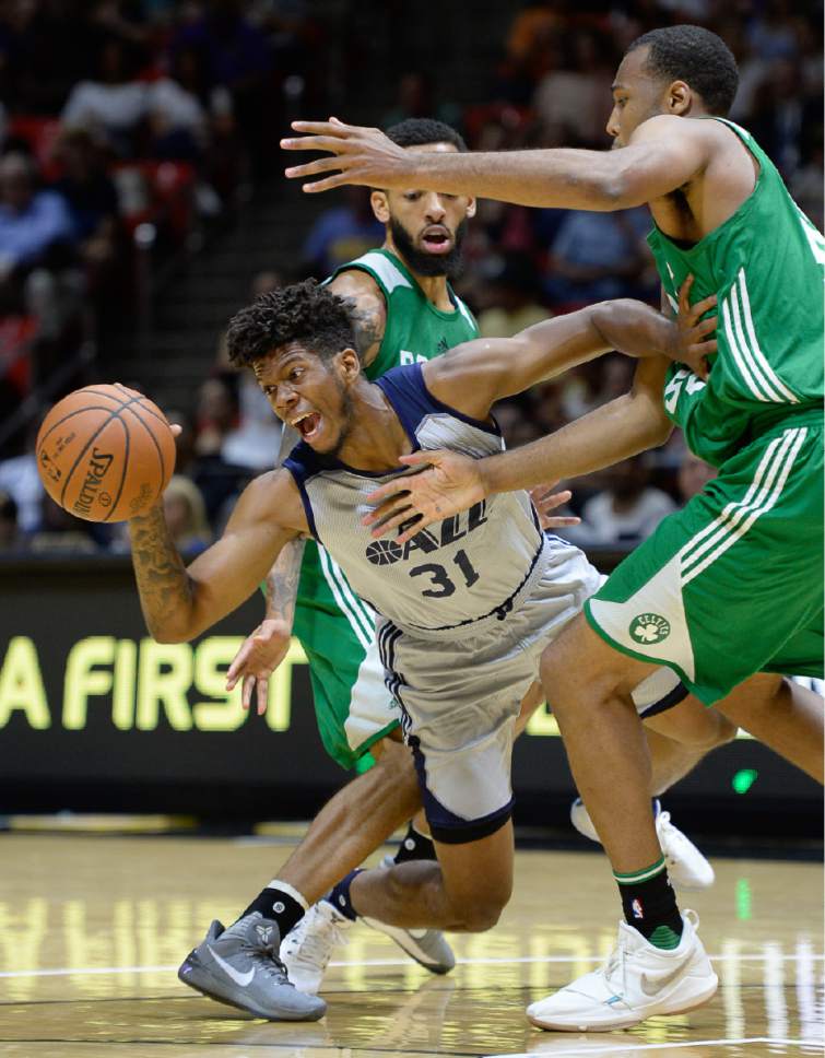 Francisco Kjolseth | The Salt Lake Tribune
Tyrone Wallace of the Utah Jazz gets squeezed by Terran Petteway and Trevor Thompson of the Boston Celtics during the first half of an NBA Summer league basketball game at the Huntsman Center, July 6, 2017, in Salt Lake City.