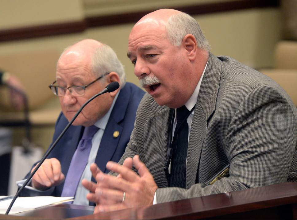 Al Hartmann  |  The Salt Lake Tribune
Utah County Sheriff Jim Tracy, right, speaks against a bill that would ban the use of carbon monoxide gas chambers to euthanize shelter animals. He argued some feral animals are more safely put down this way. Sen. Peter Knudson, R-Brigham City, left, sponsored SB56 to end what he said is an inhumane treatment of animals. The bill died on a tie 4-4 vote in the House Government Operations Committee on Thursday.