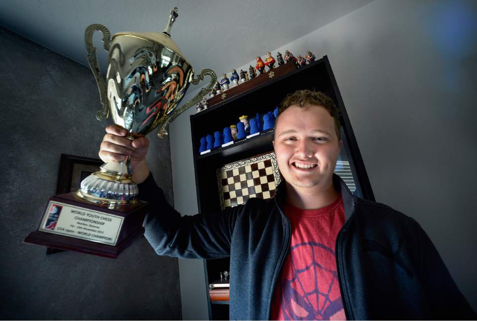 Scott Sommerdorf   |  The Salt Lake Tribune  
Nineteen-year-old Kayden Troff holds the Under 14 World Champion trophy he won in Slovenia in 2012 in his West Jordan home, Wednesday, July 5, 2017. Troff will be competing in the U.S. Junior Championship in St.Louis  – a tournament he won in 2014. He heads off on his two-year religious mission to Australia in October.