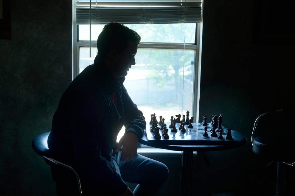 Scott Sommerdorf   |  The Salt Lake Tribune  
Nineteen-year-old Kayden Troff studies a game in his West Jordan home, Wednesday, July 5, 2017. Troff will be competing in the U.S. Junior Championship in St.Louis  – a tournament he won in 2014. He heads off on his two-year religious mission to Australia in October.
