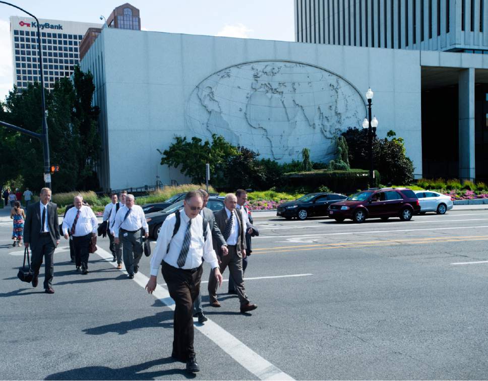 Rick Egan  |  The Salt Lake Tribune
Employees head for home from the LDS Church Office Building on Wednesday, June 28, 2017. A new dress code will allow women to wear dress slacks and professional pantsuits while men can don light-color shirts.