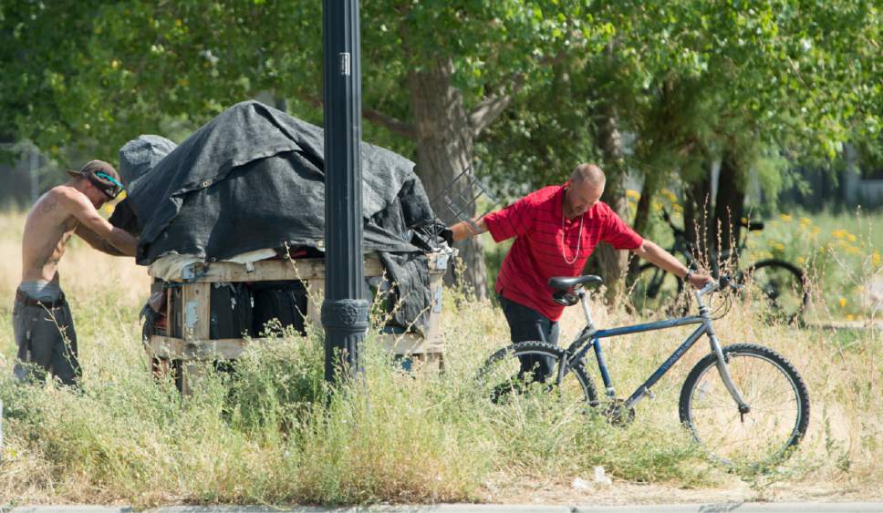 Rick Egan  |  The Salt Lake Tribune

Homeless campers are forced to remove their belongings from the Rio Grande area of Salt Lake City, as the Salt Lake County Health Department brings in heavy machinery to clean up the space on Thursday, July 6, 2017. The biggest challenge for crews is the disposal of syringes discarded by drug users.