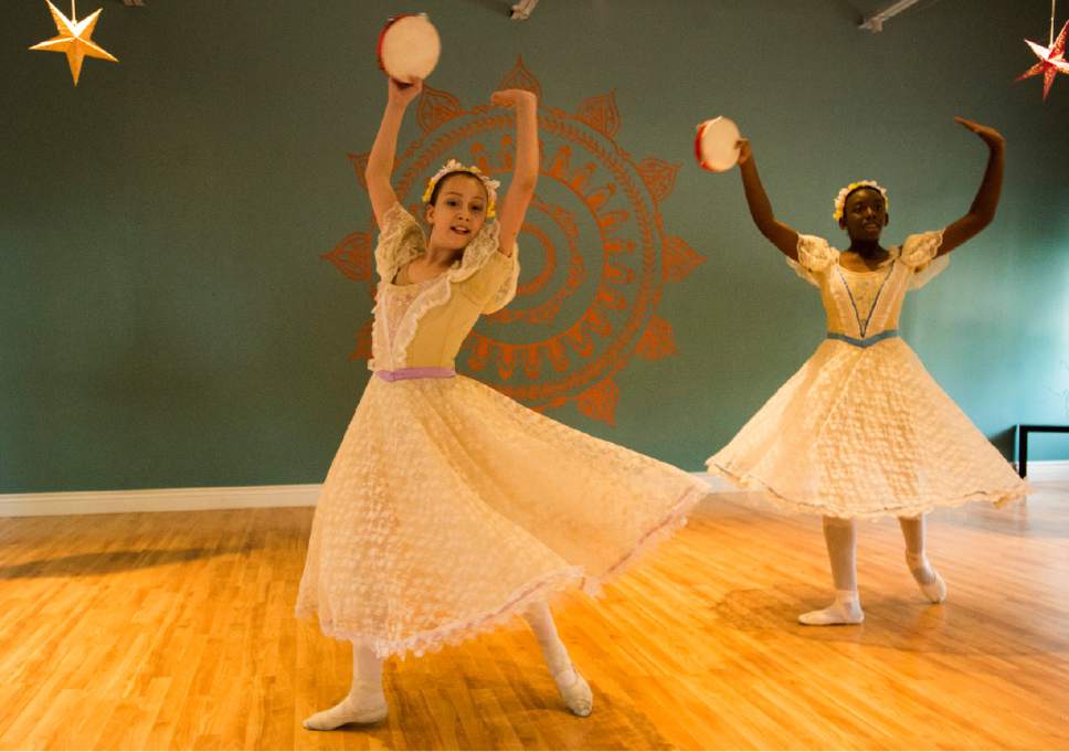 Rick Egan  |  The Salt Lake Tribune

Alexandria DeBonis and Chi Chi Eke-Ukoh perform a character dance with SLC Ballet  at the Millcreek Arts Festival at the Historic Baldwin Radio Factory, Friday, July 7, 2017.