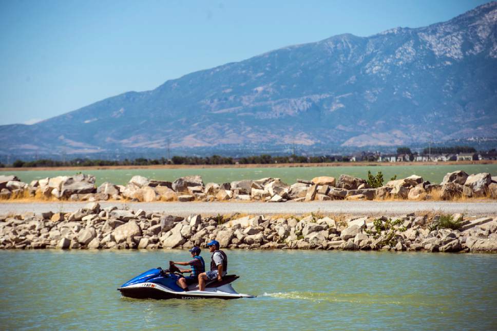 Chris Detrick  |  Tribune file photo
Jet skiers on Utah Lake on June 29. State and health officials confirmed Wednesday that the algal bloom on Utah Lake is growing and has turned toxic.