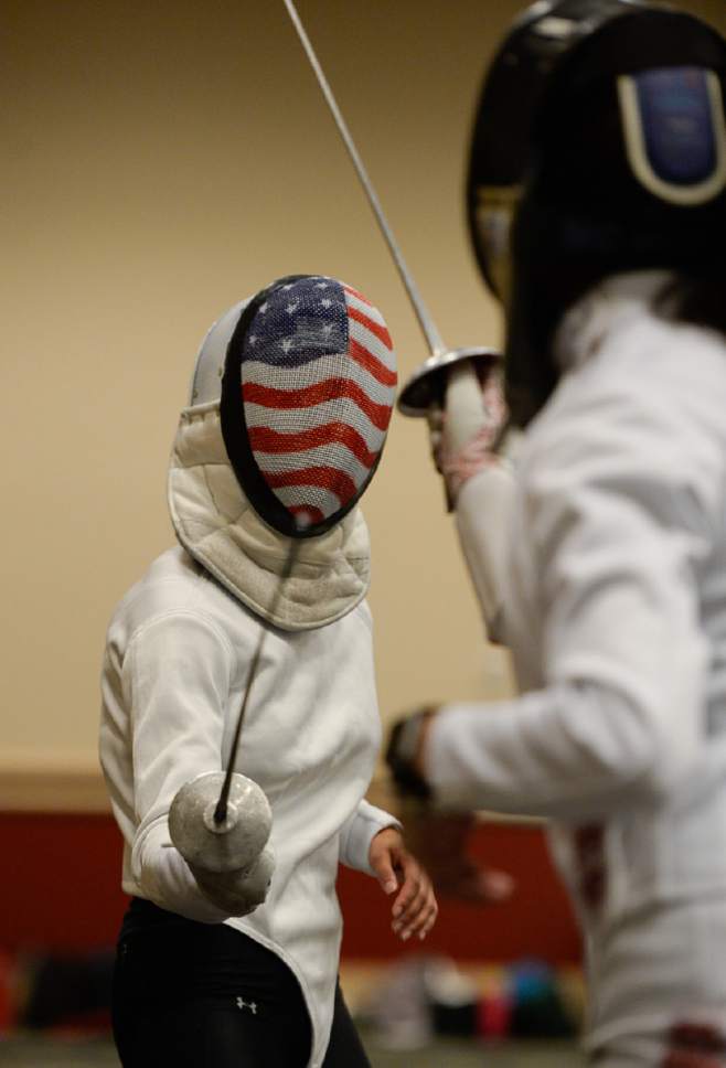 Francisco Kjolseth  |  The Salt Lake Tribune
Olympian Lee Kiefer teaches young fencers how to practice hits during the USA Fencing National Championships in Salt Lake City on Friday, July 7, 2017. More than 4,000 athletes from around the globe are competing.