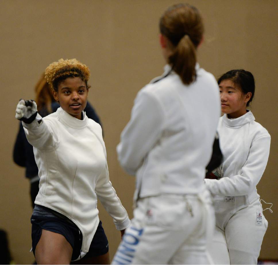 Francisco Kjolseth  |  The Salt Lake Tribune
Olympian Nzingha Prescod teaches young fencers the finer points of the foil during the USA Fencing National Championships in Salt Lake City on Friday, July 7, 2017. More than 4,000 athletes from around the globe are competing.