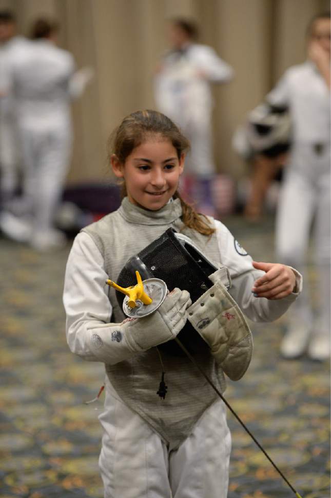 Francisco Kjolseth  |  The Salt Lake Tribune
Taylor Sartori, 12, of Rochester, NY, is all smiles as a clinic for girls moves to the foil during the USA Fencing National Championships in Salt Lake City on Friday, July 7, 2017. More than 4,000 athletes from around the globe are competing.
