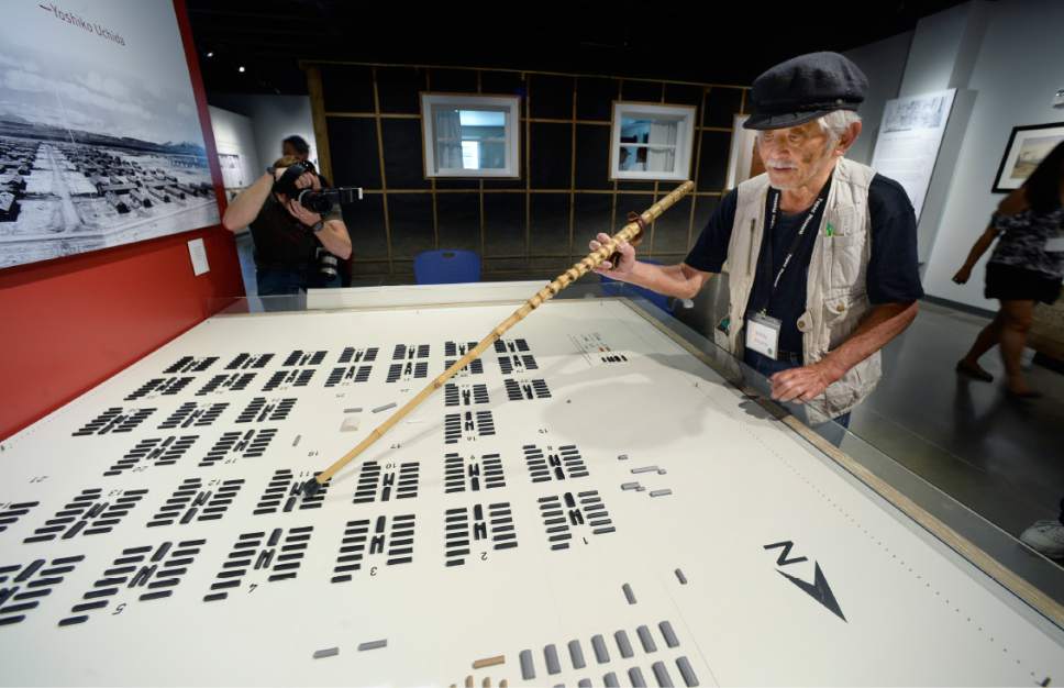 Scott Sommerdorf   |  The Salt Lake Tribune  
83 year-old Bobby Hirano who lived in the Topaz Internment Camp as a young boy uses his cane to point at the barrack in Block 11 he lived in as a ten year old during the grand opening of the Topaz Museum in Delta, Saturday, July 8, 2017.