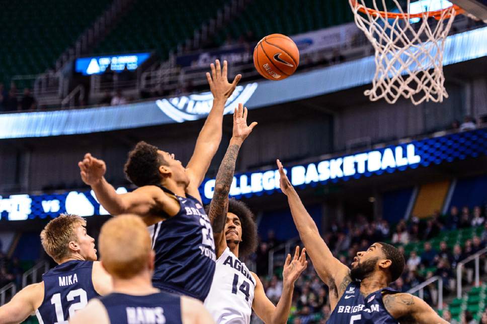 Trent Nelson  |  The Salt Lake Tribune
Utah State Aggies forward Jalen Moore (14) puts up a shot as BYU faces Utah State, NCAA basketball in Salt Lake City, Wednesday November 30, 2016.