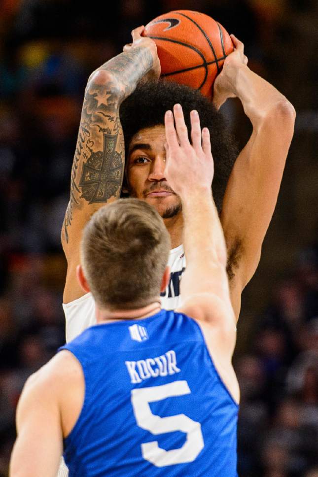 Trent Nelson  |  The Salt Lake Tribune
Utah State Aggies forward Jalen Moore (14) defended by Air Force Falcons guard Zach Kocur (5) as Utah State hosts Air Force, NCAA basketball in Logan, Saturday February 25, 2017.