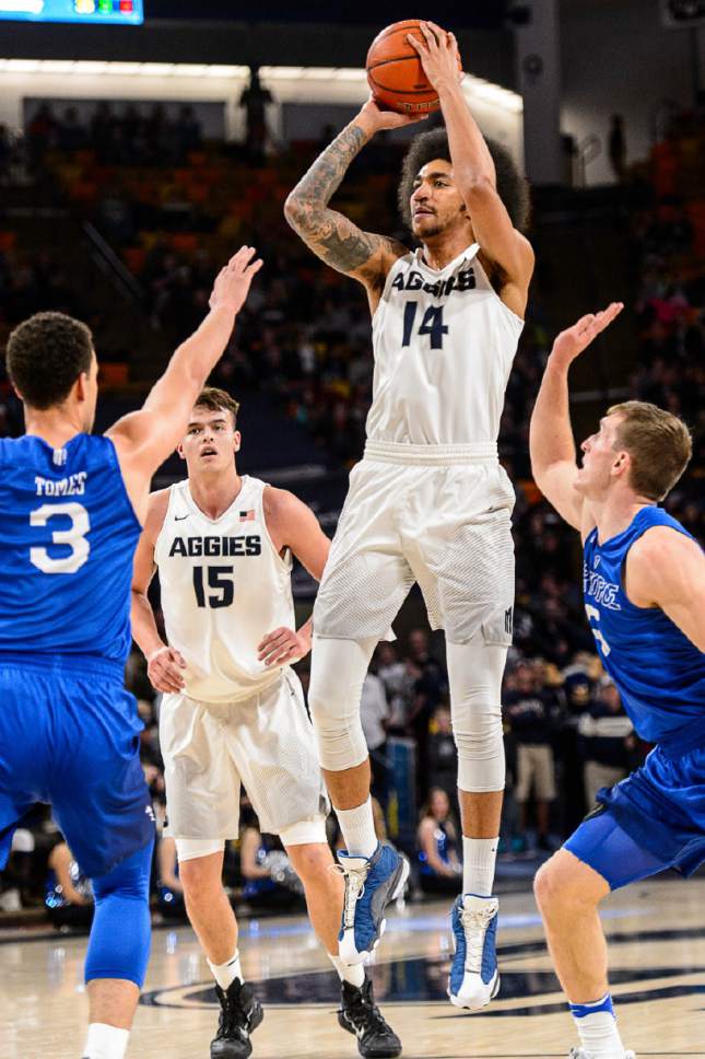 Trent Nelson  |  The Salt Lake Tribune
Utah State Aggies forward Jalen Moore (14) shoots as Utah State hosts Air Force, NCAA basketball in Logan, Saturday February 25, 2017.