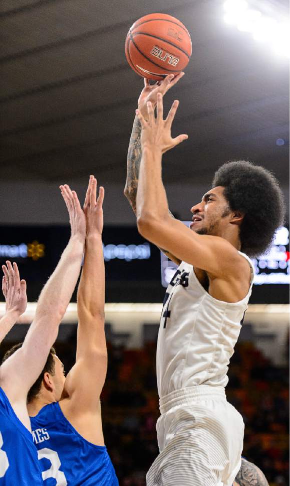 Trent Nelson  |  The Salt Lake Tribune
Utah State Aggies forward Jalen Moore (14) shoots as Utah State hosts Air Force, NCAA basketball in Logan, Saturday February 25, 2017.