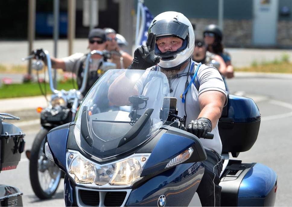Scott Sommerdorf   |  The Salt Lake Tribune  
Riders begin the first annual Utah 1033 Ride, Sunday, July 9, 2017. The event honors those who made the ultimate sacrifice while serving in the line of duty. The event is named after The Utah 1033 Foundation, a local non-profit dedicated to providing immediate financial support to families of Utah's fallen law enforcement officers.