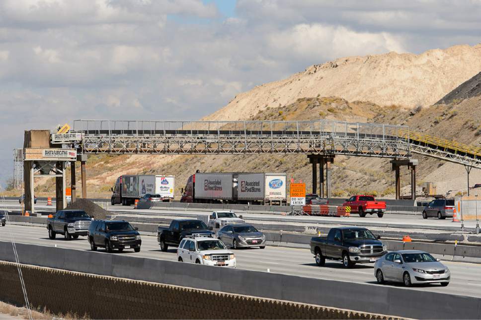 Trent Nelson  |  The Salt Lake Tribune
A new conveyor belt bridge goes over northbound I-15 traffic near the Point of the Mountain, Tuesday October 6, 2015. The bridge transports concrete from the batch plant over the highway and directly into the work zone (in the middle of the freeway) as part of a two-year project to widen I-15 to six lanes in each direction from Lehi to Draper.