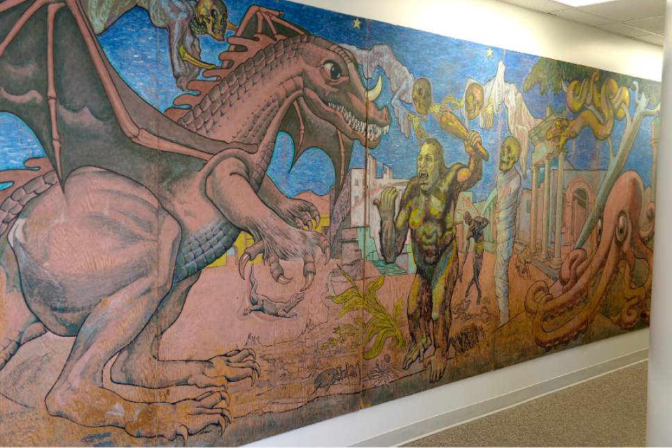 Leah Hogsten  |  The Salt Lake Tribune 
From 1967 to 2010, visitors to Lagoon passed by this massive hand-painted mural painted by Bill Tracy, at the entrance of Lagoon's Terroride. The mural's characters included a dragon and an ape in a stand-off, a giant octopus and eery-looking flying skeletons. The mural was moved to Lagoon's corporate office in an effort to preserve the original work. The newly copied and painted mural will debut summer 2017.