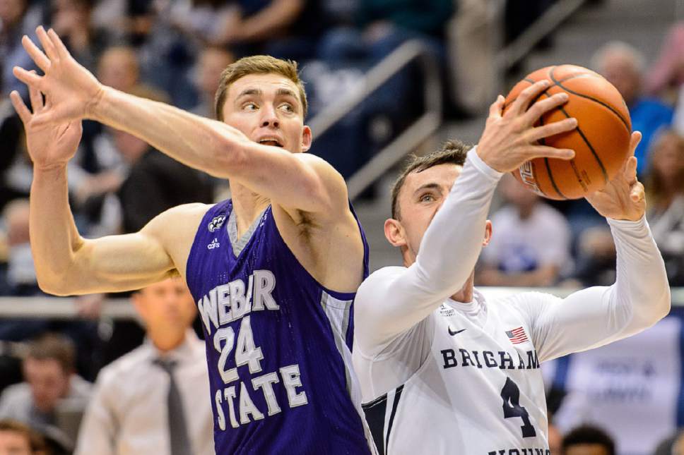 Trent Nelson  |  The Salt Lake Tribune
Brigham Young Cougars guard Nick Emery (4) drives past Weber State Wildcats guard McKay Cannon (24) as BYU hosts Weber State, NCAA basketball at the Marriott Center in Provo, Wednesday December 7, 2016.