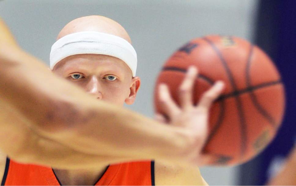 Steve Griffin  |  The Salt Lake Tribune

Brighton's Brock Miller (3) eyes the ball during quarterfinals of the boy's 5A basketball state tournament game against Hunter and Brighton at the Dee Event Center in Ogden, Wednesday, February 25, 2015.